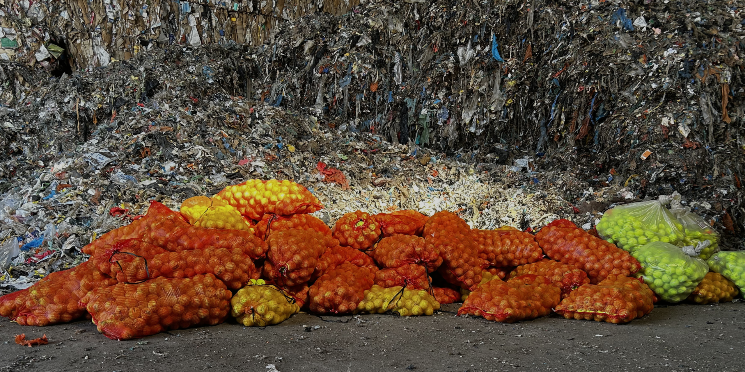 used tennis balls at a recyclinc site